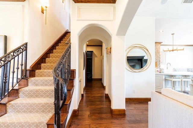 interior space featuring hardwood / wood-style flooring and a notable chandelier