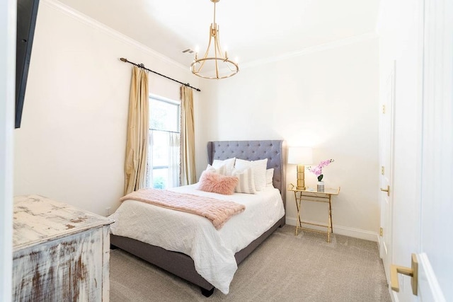 carpeted bedroom featuring crown molding and a chandelier