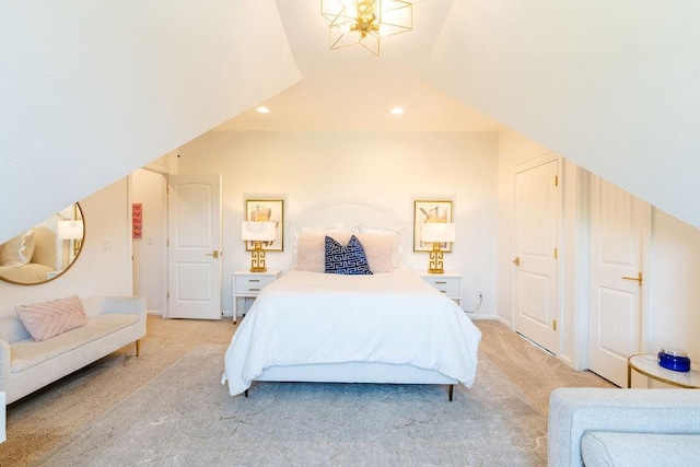 bedroom featuring light colored carpet and lofted ceiling