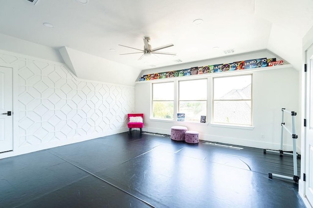 workout room with vaulted ceiling and ceiling fan