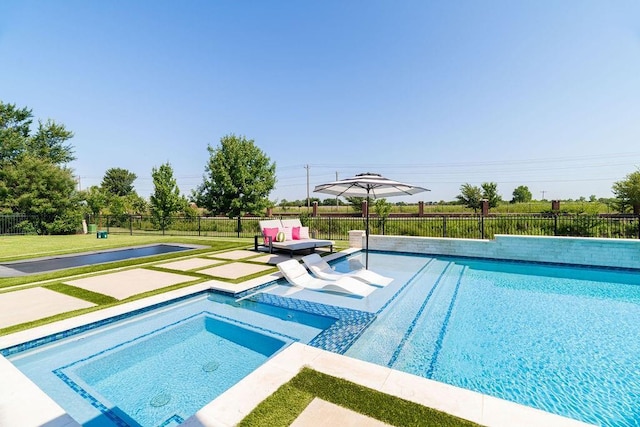 view of pool with an in ground hot tub