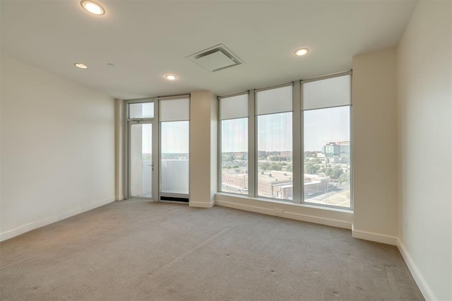 spare room with light colored carpet