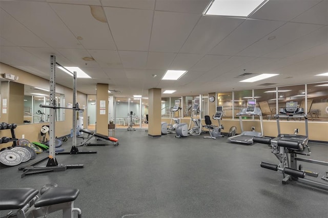 workout area with a paneled ceiling