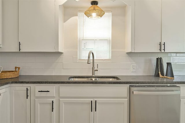 kitchen featuring dishwasher, sink, and white cabinets