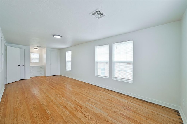 unfurnished bedroom featuring light wood-type flooring