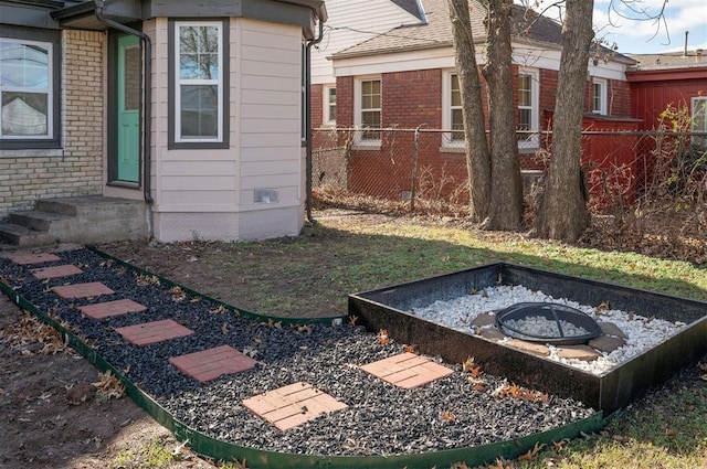 view of yard with an outdoor fire pit