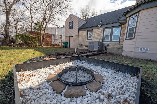 exterior space featuring a fire pit and central AC unit