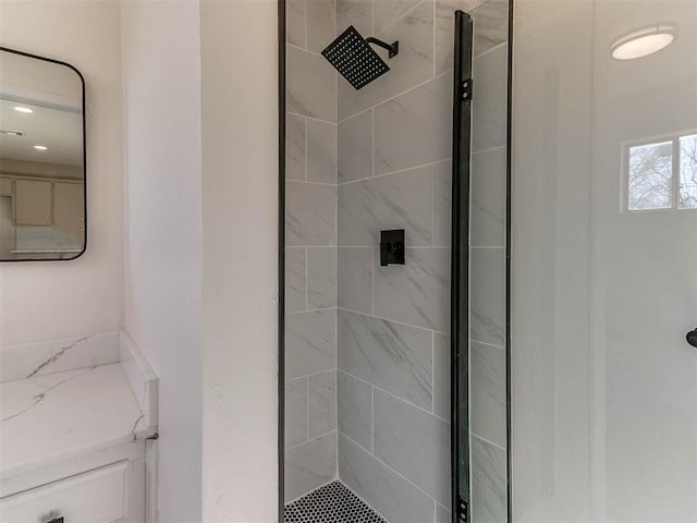 bathroom with a tile shower