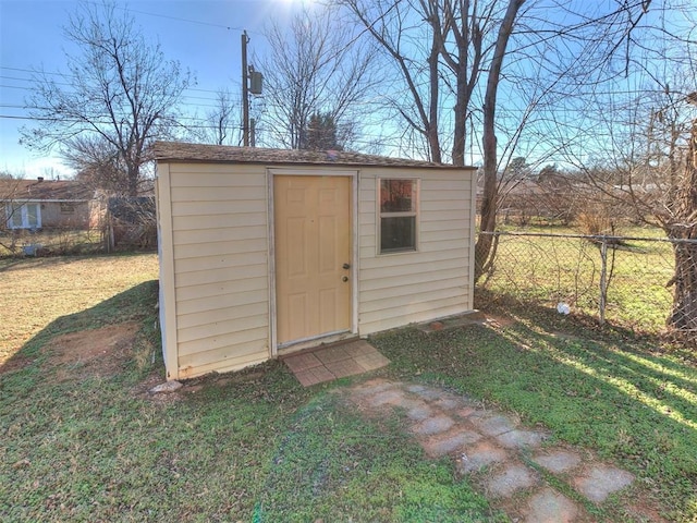 view of outbuilding featuring a yard