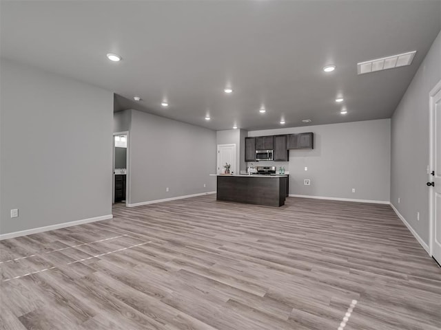 unfurnished living room featuring light hardwood / wood-style flooring