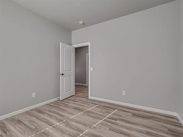 spare room featuring light hardwood / wood-style floors