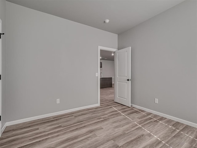 unfurnished room featuring light hardwood / wood-style flooring