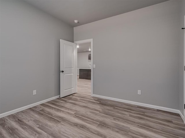 unfurnished room featuring light wood-type flooring