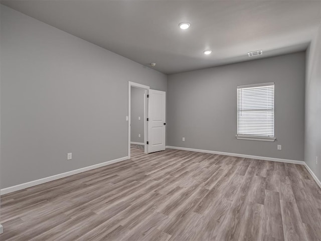 unfurnished room featuring light hardwood / wood-style flooring