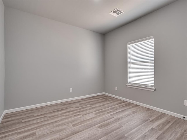 unfurnished room featuring light wood-type flooring