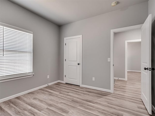 unfurnished bedroom with light hardwood / wood-style flooring