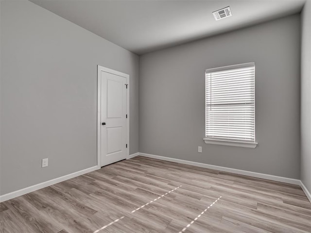 empty room with light wood-type flooring