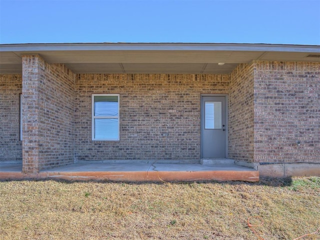 doorway to property with a patio