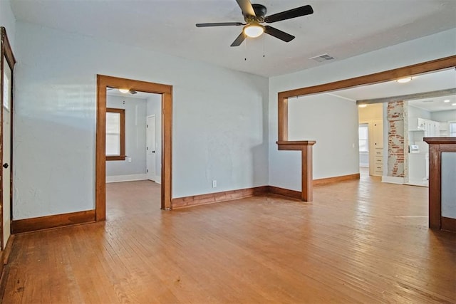 unfurnished room featuring light wood-type flooring and ceiling fan