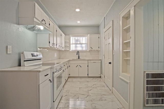 kitchen with sink, tasteful backsplash, a textured ceiling, white appliances, and white cabinets