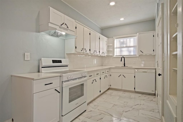 kitchen with decorative backsplash, white appliances, white cabinetry, and sink