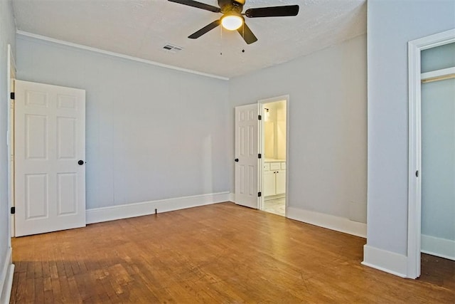 unfurnished bedroom with a closet, ceiling fan, and hardwood / wood-style floors