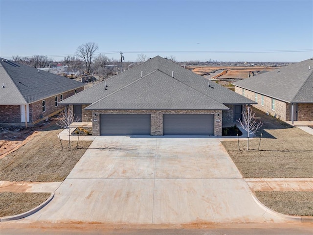 ranch-style house featuring a garage