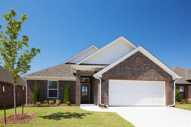 view of front of home with a garage and a front yard