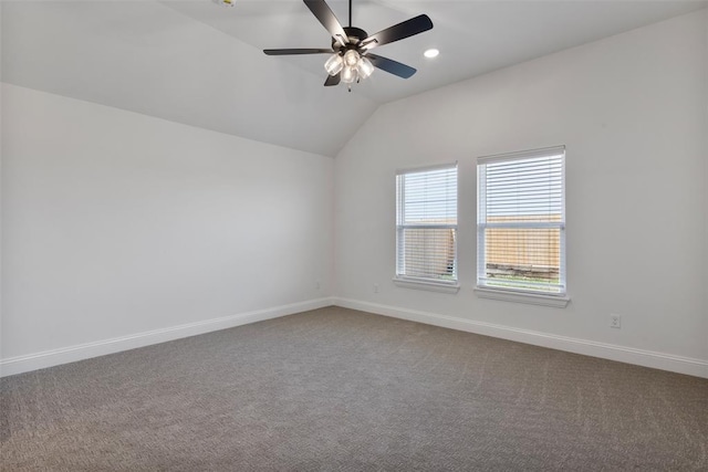 unfurnished room with ceiling fan, carpet, and lofted ceiling