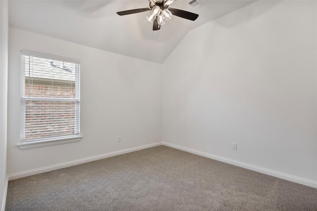 unfurnished room featuring ceiling fan, carpet floors, and lofted ceiling