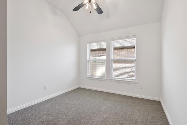 unfurnished room with carpet flooring, vaulted ceiling, and ceiling fan