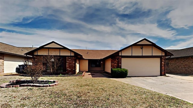 view of front of home with a front yard and a garage