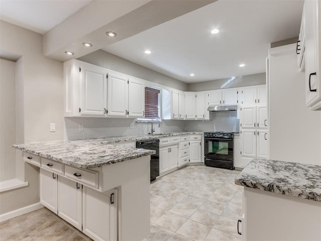 kitchen with sink, light stone counters, black appliances, kitchen peninsula, and white cabinets