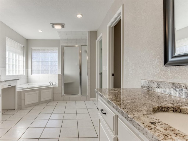 bathroom with vanity, tile patterned floors, and independent shower and bath