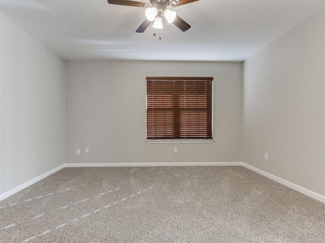 unfurnished room with ceiling fan and carpet floors