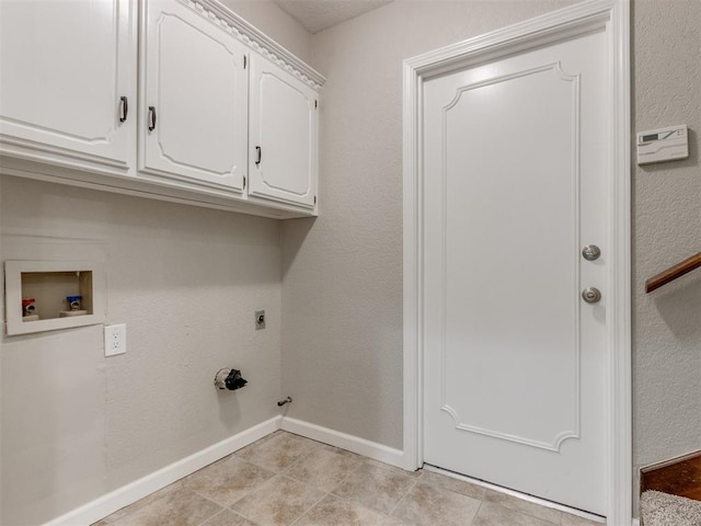 washroom featuring cabinets, electric dryer hookup, hookup for a washing machine, and hookup for a gas dryer