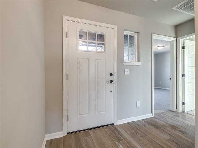 entryway with light hardwood / wood-style floors