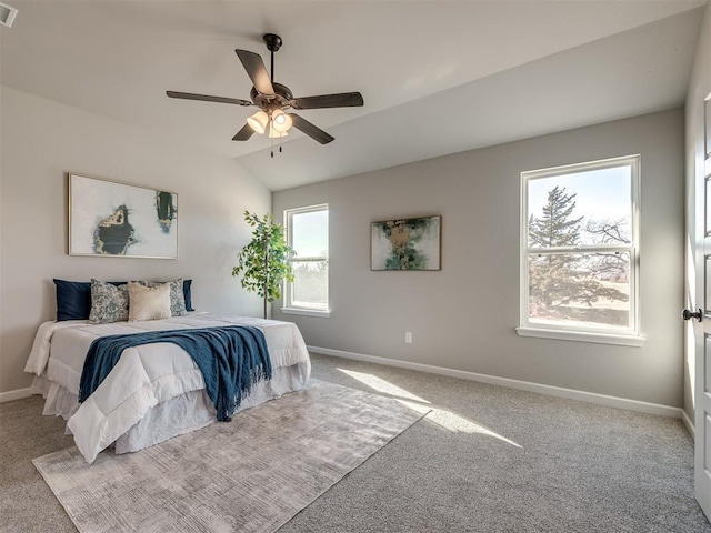 carpeted bedroom featuring ceiling fan and lofted ceiling