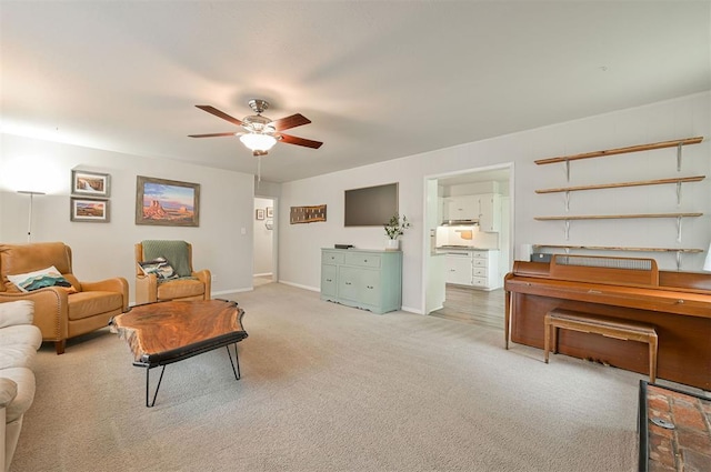 carpeted living room featuring ceiling fan