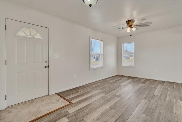 entryway with ceiling fan and light wood-type flooring