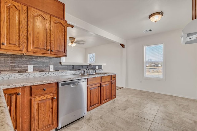 kitchen featuring light stone countertops, tasteful backsplash, ceiling fan, sink, and dishwasher