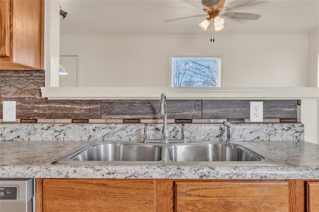 kitchen with backsplash, dishwasher, and sink