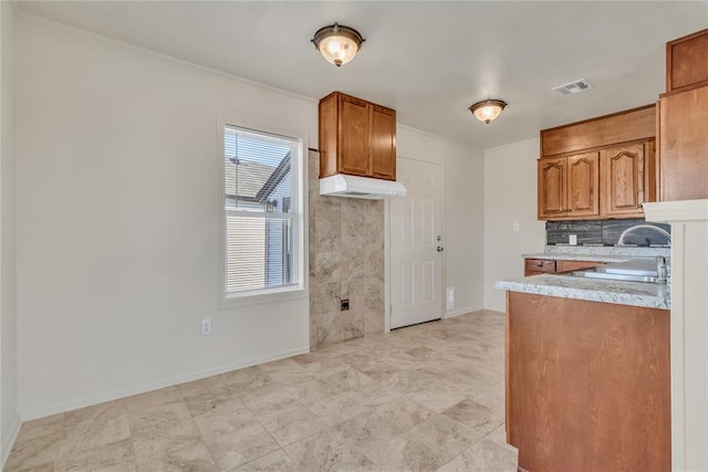 kitchen with decorative backsplash and sink