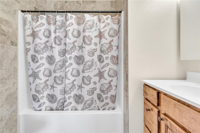 bathroom featuring vanity and shower / tub combo with curtain