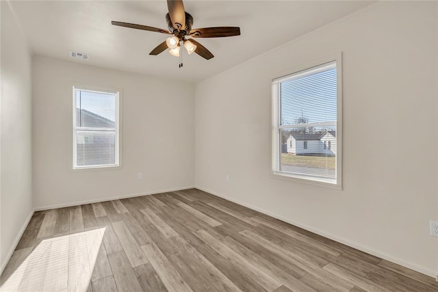 unfurnished room featuring light hardwood / wood-style flooring and ceiling fan