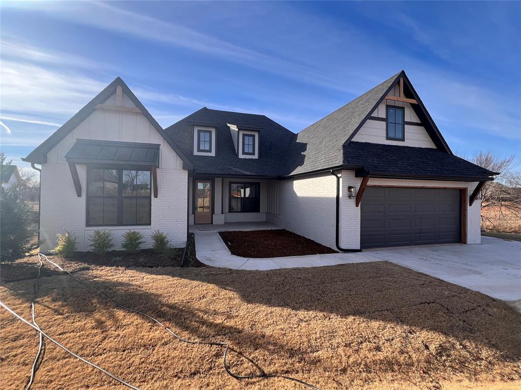 modern farmhouse featuring a garage