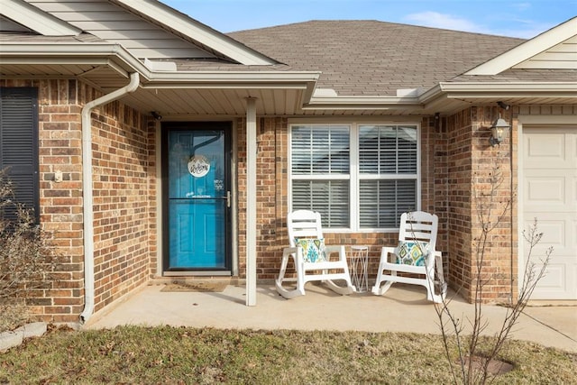 view of exterior entry featuring a garage