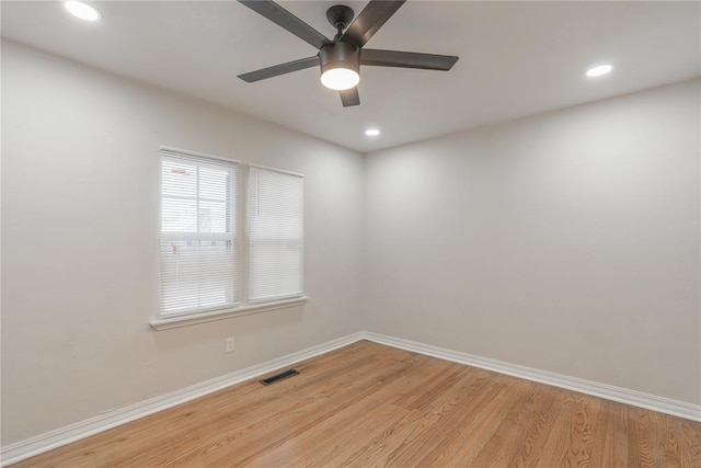 unfurnished room with ceiling fan and light wood-type flooring