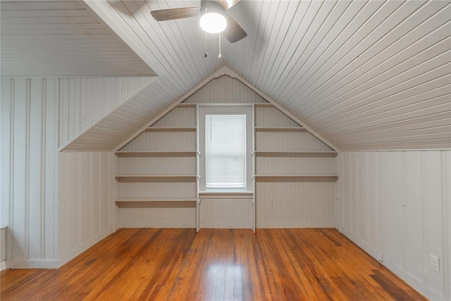 additional living space featuring lofted ceiling, ceiling fan, and dark hardwood / wood-style flooring