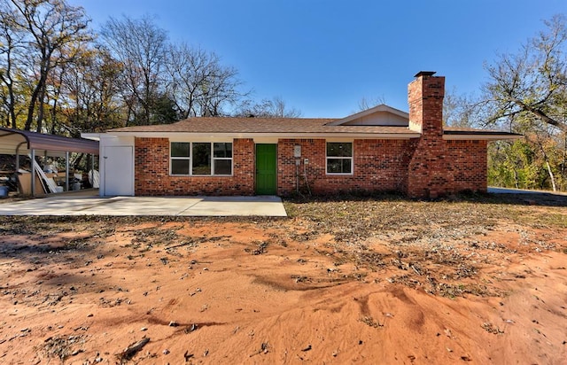 rear view of property featuring a patio area